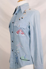 Men's or women's vintage 1970's BJ-R, Long Tail - Form Fit, Made in Hong Kong label long sleeve light blue denim chambray button up shirt with colored embroidery all over.