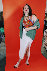 Women's vintage 1970's Sirena label sleeveless one piece swimsuit with all over orange, red, and purple print.