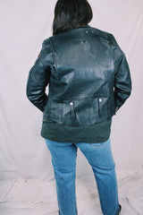 Men's or women's vintage 1970's Harley-Davidson label long sleeve black leather motorcycle jacket with silver hardware and patches.