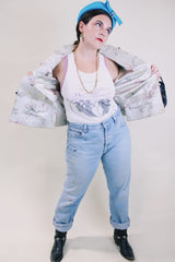 Women's vintage 1960's satin reversible robe jacket in black and grey with all over embroidered print. Mandarin collar and fabric buttons.