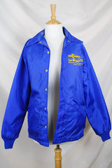 Women's or men's vintage 1980's Swingster, World of Wearables label long sleeve lightweight bright blue nylon windbreaker jacket with logo on left chest, popper buttons, and furry fleece liner.