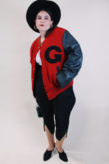 Men's or women's vintage 1970's De Long Sportswear Classics label long sleeve letterman bomber jacket with red wool body and black leather arms.