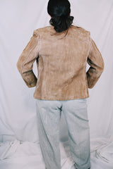 Men's or women's vintage 1970's light tan brown suede leather jacket with cream soft shearling liner. Zipper front closure and side pockets.