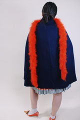 Women's vintage 1960's navy blue wool material poncho with slits for arms, gold hardware and gold buttons. Fully lined.