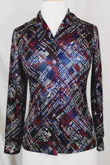 Women's vintage 1970's long sleeve button up blouse with a dagger collar in a navy blue color and all over abstract print.