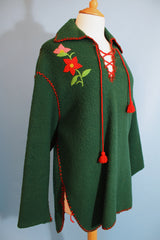 Women's vintage 1970's Indian, Handcrafted by Canadian Indians label long sleeve forest green pullover sweater with a collar and tie front.