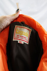Women's or men's vintage 1970's Cascade, Made in Korea label long sleeve zip up brown and orange colored nylon puffer jacket.