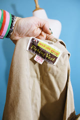 Men's or women's vintaGe 1980's Wild Life Brand, Fishing Vest label sleeveless light tan colored zip up vest in a cotton material. Has multiple pockets in the front.
