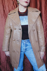 Women's vintage 1970's Nordstrom label long length long sleeve tan brown colored double breasted leather trench coat.