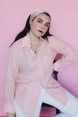 Men's or women's vintage 1970's Montgomery Ward label long sleeve cotton and polyester material pink striped button up shirt with clear buttons.