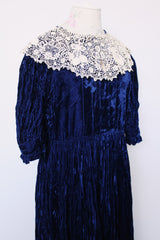 Women's vintage 1970's crushed blue velvet dress with cream embroidery peter pan collar. Short sleeves and ankle length.