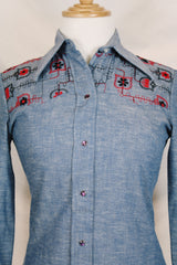 Women's vintage 1970's Western Trends by Panhandle Slim, Made in USA label long sleeve chambray denim top with black and white embroidery.