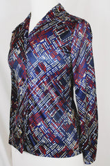 Women's vintage 1970's long sleeve button up blouse with a dagger collar in a navy blue color and all over abstract print.