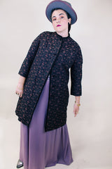 Women's vintage 1960's Helen's Fashion Shoppe, McMinnville, Oregon label long sleeve long length jacket in a black and purple tapestry print.