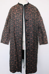 Women's vintage 1960's Helen's Fashion Shoppe, McMinnville, Oregon label long sleeve long length jacket in a black and purple tapestry print.