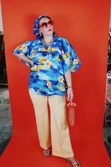 Women's vintage 1980's Made in Hawaii short sleeve wide cape blouse in all over blue Hawaiian print.