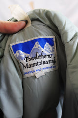 Women or men's vintage 1980's Powderhorn Mountaineering, Jackson Hole, Wyoming, USA label long sleeve puffer jacket in maroon and green.