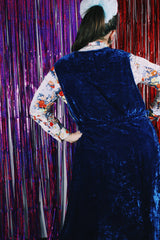 Women's vintage 1970's sleeveless dark blue crushed velvet knee length dress. Has a deep V shaped neckline in the front.