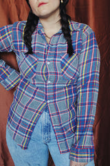 Men's or women's vintage 1970's Big Mac label long sleeve plaid button up flannel shirt in blue, grey, red, and yellow with white buttons.