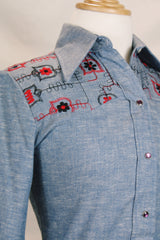 Women's vintage 1970's Western Trends by Panhandle Slim, Made in USA label long sleeve chambray denim top with black and white embroidery.