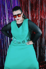 Women's vintage 1970's Saks Alley label sleeveless midi length kelly green polyester dress with sequin detail on chest.