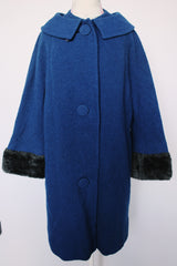 Women's vintage 1960's Jack Bloom California label long sleeve royal blue color coat. Ankle length with grey fur trim around collar and cuffs.