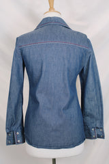 Women's vintage 1970's By Bogat of Texas long sleeve button up medium wash denim chambray top with red and white contrast stitching.