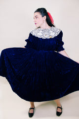 Women's vintage 1970's crushed blue velvet dress with cream embroidery peter pan collar. Short sleeves and ankle length.