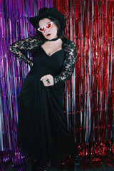 Women's vintage 1980's Made in USA label long sleeve ankle length black dress made with Polyester material.