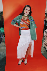 Women's vintage 1970's Sirena label sleeveless one piece swimsuit with all over orange, red, and purple print.