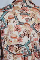 Men's or women's vintage 1970's long sleeve cream colored polyester button up shirt with all over multi colored tree print shirt.