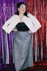 Women's vintage 1970's maxi length navy blue skirt. Skirt has an all over silver and gold embroidered metallic pattern.