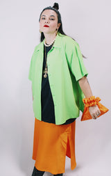 Women's vintage 1980's Collection by Shirq, New York, Made in USA label short sleeve bright lime green button up blouse with collar and shiny trim in a lightweight poly material.