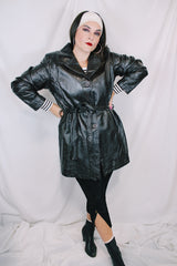 Women's vintage 1980's Leather King label long sleeve dark chocolate brown long length leather coat with button front closure and matching tie belt.