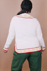 Women's vintage 1970's New Improved Kimlon by RBK Importers label size medium long sleeve white acrylic pullover sweater with half closure and red and yellow trim.