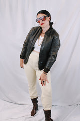 Men's or women's vintage 1950's Genuine Horsehides All Weather Garment, San Francisco, California label long sleeve brown leather bomber jacket with ribbed knit trim and quilted liner.