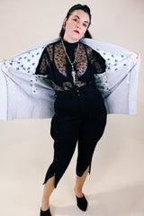 Women's vintage 1960's long sleeve textured kimono. Baby blue color with blue and white floral liner. Ties in the front. Wide big sleeves.