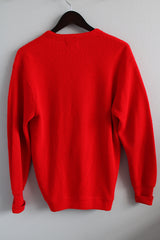 Women's or men's vintage 1980's Izod Lacoste label long sleeve bright red colored button up cardigan sweater with small alligator patch on left chest.