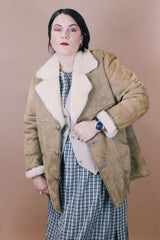 Men's or women's vintage 1970's Skinny's Hideout, Knight Tailors LTD. Australasia, Made in New Zealand label size large long sleeve tan brown suede medium length coat with cream shearling liner.