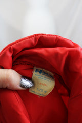 Women's or men's vintage 1980's Horizon Sportswear Inc., Made in USA label long sleeve red nylon puffer jacket with patch on left chest.