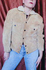 Women's or men's vintage 1950's Alaska Sleeping Bag Co., Portland, Oregon label long sleeve tan colored suede jacket with popper buttons and cream shearling liner.