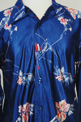 Men's or women's vintage 1970's Montgomery Ward label shiny vibrant navy blue button up shirt with dagger collar and all over floral print.