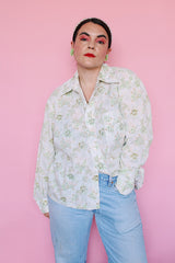 Men's or women's vintage 1970's Sutton Place label long sleeve button up shirt in white with all over green floral print.