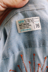 Men's or women's vintage 1970's JCPenney label long sleeve light blue chambray denim shirt with all over colored embroidery.