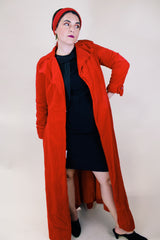 Women's vintage 1950's/60's Count Romi LTD., Your All Weather Traveler label long sleeve long length bright red velvet duster coat. One closure at waist.