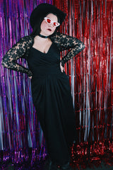 Women's vintage 1980's Made in USA label long sleeve ankle length black dress made with Polyester material.