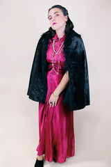 Women's vintage possibly 1940's black colored pony fur large cape poncho with fur trim around the edges. Has a closure at the neck and the peter pan collar and fully lined.