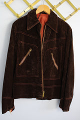 Men's or women's vintage 1970's long sleeve short length chocolate brown jacket in a fuzzy soft suede material. Gold hardware, zipper up the front, contrast stitching, and dagger collar.