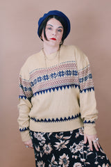 Women's or men's vintage 1980's size large long sleeve tan colored pullover sweater in an acrylic material. Navy and maroon print.