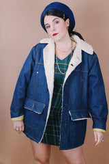 Men's or women's vintage 1970's Montgomery Ward label size medium long sleeve dark wash denim jacket with cream colored shearling liner.